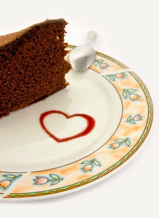 Heart, shape and spoon on plate with a piece of gingerbreadの写真素材