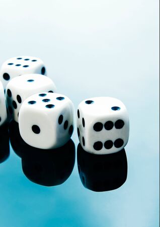 Dices on blue reflected backgroundの写真素材