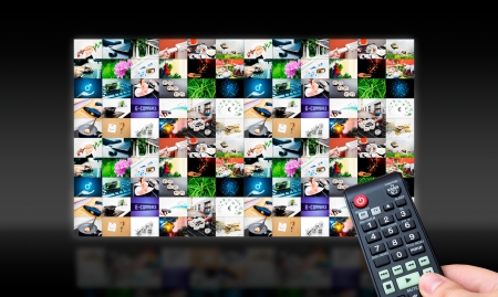 Remote control with virtual multimedia screen in background. Black and glossy compositionの写真素材