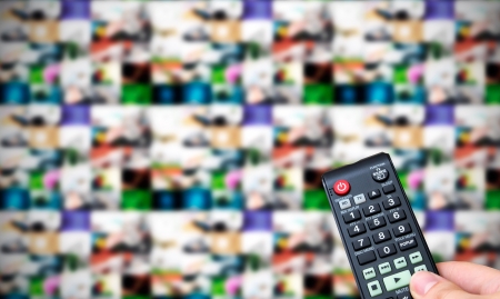 Remote control. Multiple images gallery panel in backgroundの写真素材