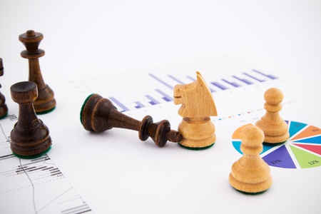 Chess pieces on business background. Company strategic behaviorの写真素材
