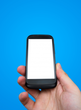 Hand holding mobile phone. Smartphone with blank displayの写真素材