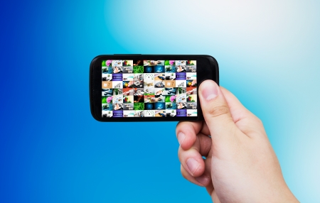 Smart phone with multimedia gallery. Internet and TV streaming compositionの写真素材
