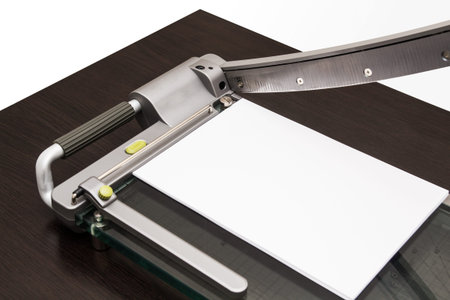 Sheet of paper in the guillotine