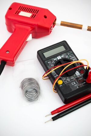 Soldering tool, multimeter on white backgroundの写真素材