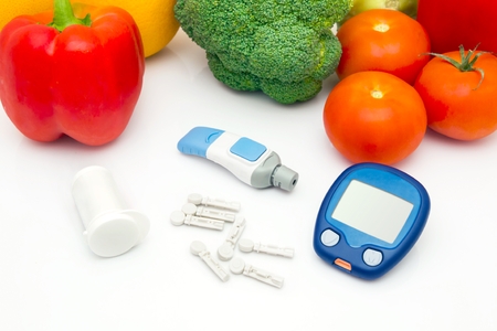 Glucose meter device with accessories. Vegetables and healthy lifestyleの写真素材
