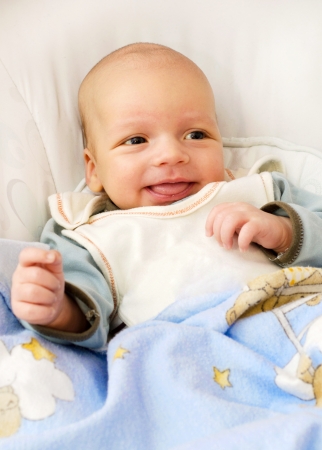 Newborn baby boy smiling の写真素材
