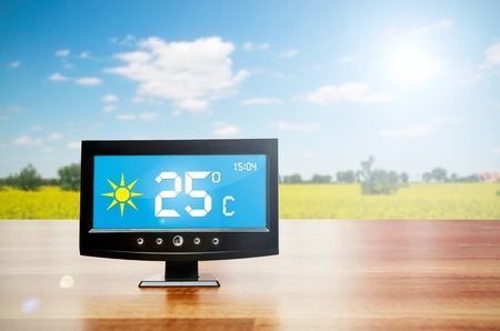 Weather station device with weather conditions outside backgroundの写真素材