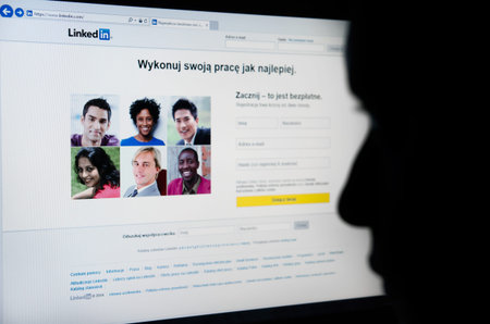 Face looking at Linkedin.com homepage on the screen - business-oriented social networking service 