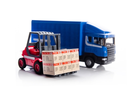Forklift truck toys with boxes. Concept of international freight transportの写真素材
