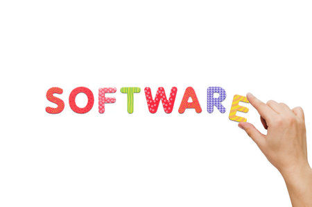 Hand put the word Software with magnetic letters. Colorful alphabet kit