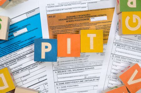 PIT word with colorful blocks. polish tax form money business finance block conceptの写真素材