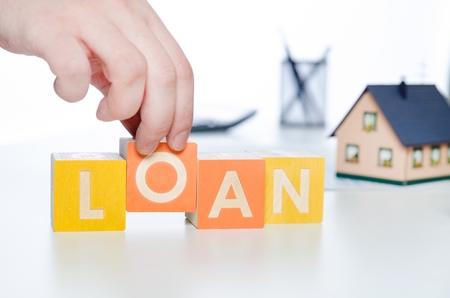 LOAN word with colorful blocks. loan word debt forecasting money financial cube repaying conceptの写真素材