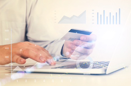 Man using laptop at workplace. credit card pay commerce shopping buy internet laptop conceptの写真素材