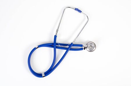 Blue stethoscope isolated on white. stethoscope isolated white background health check blue equipment conceptの写真素材