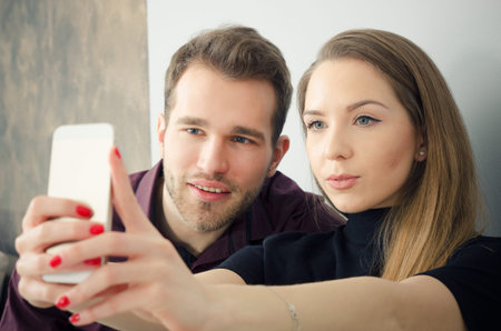 Young couple taking a selfie photo. selfie young couple technology taking photo happy love concept