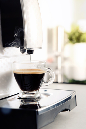 Home professional coffee machine with espresso cup. coffee machine espresso kitchen cup hot italian white conceptの写真素材