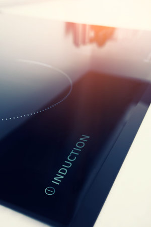 Induction symbol on electrical stove. appliance black burner burning ceramic ceran control cook conceptの写真素材