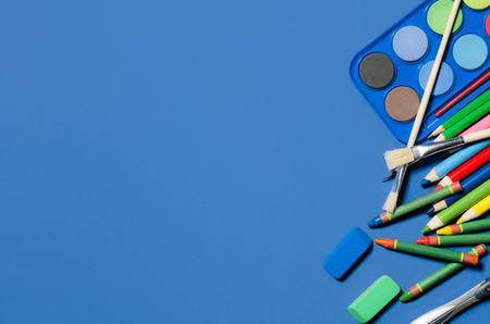 School and office stationery, blue background, copyspace. stationery office desk top view table school student conceptの写真素材