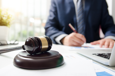 Wooden gavel on table. Attorney working in courtroom. law attorney court judge justice gavel legal legislation conceptの写真素材