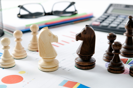 Financial business strategy. Chess on desk in office concept.の写真素材