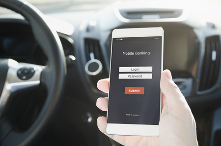 Mobile banking service application on smart phone. Access to banking during the tripの写真素材