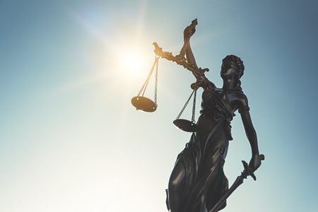 The Statue of Justice - lady justice, Themis, Justitia on sky background. Justice system conceptの写真素材