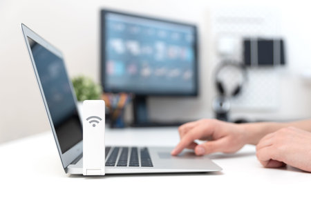Wireless internet concept. Man using mobile network expander or mobile internet modem USB stick