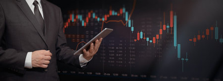 Stock market trading graph, investment candlestick chart. Investor with digital tablet, copy space...