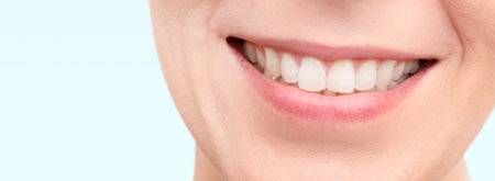 Smiling woman mouth with white teeth. Copy space web banner background.