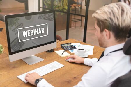 Man gets knowledge from an online course, webinar, e-learning platform.の写真素材