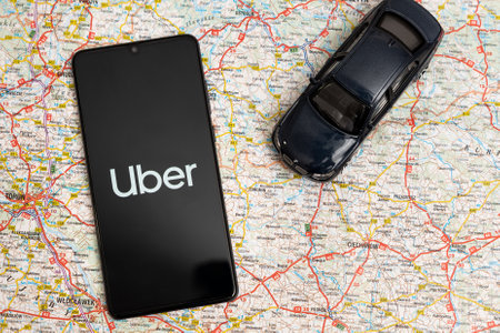 Wroclaw, Poland - OCT 23, 2019: Uber logo on Huawei P30. Uber is sharing-economy service for ubran transport.のeditorial素材