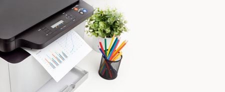 Multifunction device, copier, scanner, printer in office. Professional laser printer wide image with...