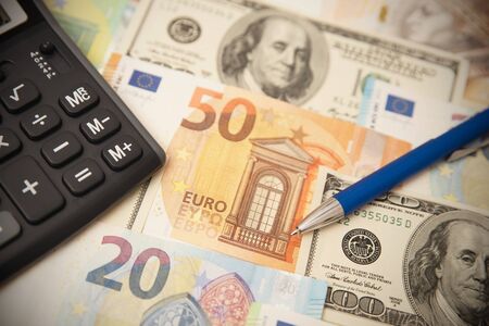 Currency banknotes euro, dollar background. Money, finance, international currency conceptの写真素材