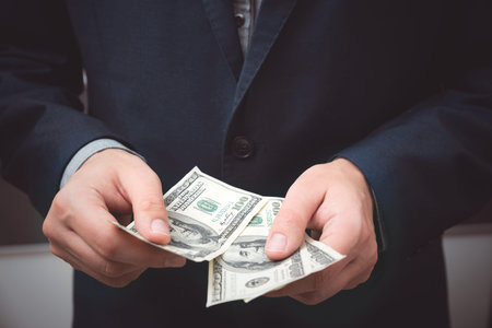 Man counts dollar banknotes. Business and finance, salary concept
