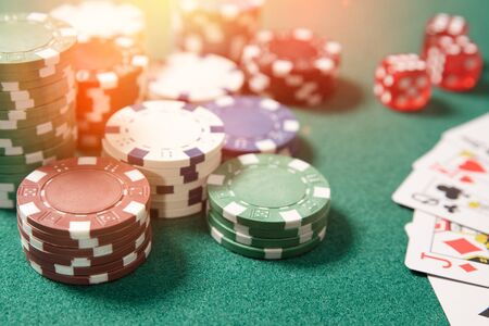 Poker chips, cards on green table. Gambling in casino concept.の写真素材