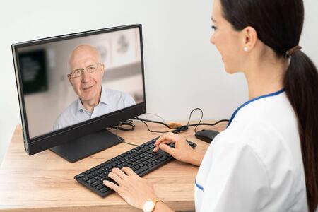 Doctor and senior man patient medical consultation, telehealth, telemedicine, remote health care concept.の写真素材