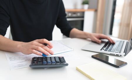 Unemployment problem, business failure. Man making financial revision.の写真素材