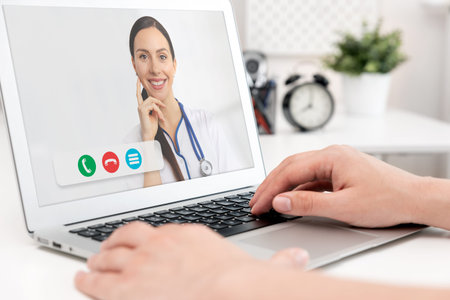 Doctor with a stethoscope on the computer laptop screen. Telemedicine or telehealth concept.