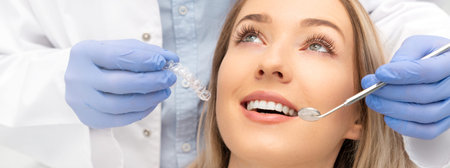 Woman having teeth examined at dentists. Teeth whitening, dental care concept