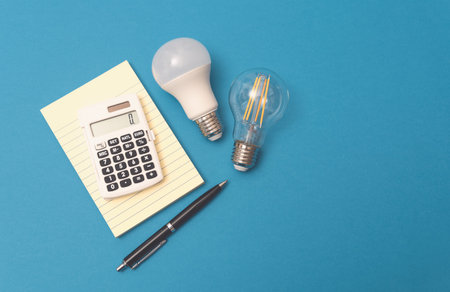 Light bulbs, energy efficiency concept on blue background