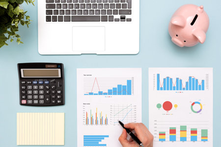 Accountant working with documents. Financial reports on desk, flat layの写真素材