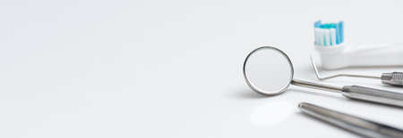 Dental tools on a white background. Medical tools set. Wide image background with copy spaceの写真素材