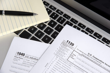 US Individual income tax return. US tax forms on laptop