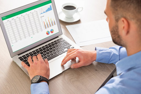 Business analytics applications on laptop. Financial data analysis concept. Business analyst works with dataの写真素材