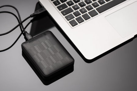 External backup disk hard drive connected to laptop