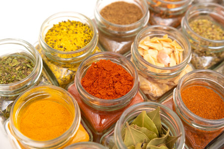Spice jars, spice background. Various spices used in the kitchenの写真素材