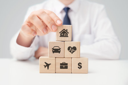 Social security concept. Insurance agent and wooden blocks with insurance symbols