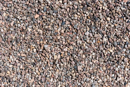 Loose stone gravel. Stones background texture top view