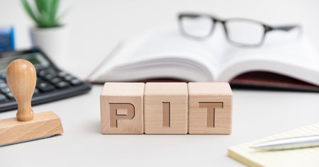 PIT - Polish tax concept with wooden blocks. Budget, finance and taxの写真素材